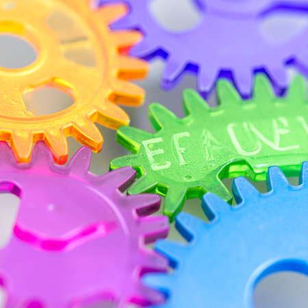 A macro shot of vibrant, interlocking gears working in perfect harmony.の素材
