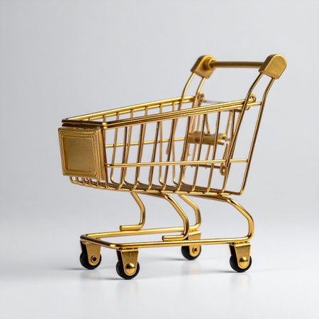 A pristine, golden shopping cart stands alone on a clean white background, symbolizing premium consumer experiences and high-value commerce.の素材