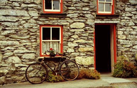 Old house with bicycle, bikeの写真素材