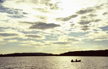 Rowboat on the Chiemsee at sunset