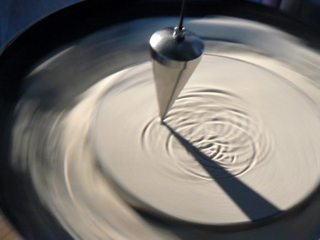 Pendula over surface of sandの写真素材