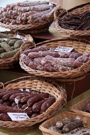 Sausages in baskets on farmers market in Riquewihr, Alsace, Franceの写真素材