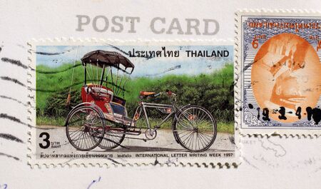 Postage stamps from  Thailand with rickshawの写真素材