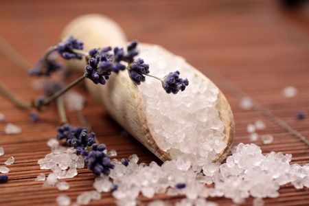 Small wooden shovel with bath salt and lavenderの写真素材