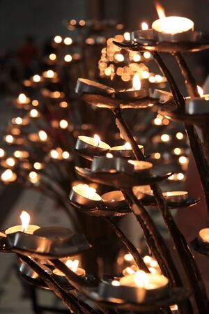 Tea lights on an iron chandelier in the Cathedral of Santa Maria del Fiore in Florenceのeditorial素材