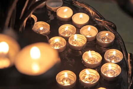 Tea lights on an iron chandelier in the Cathedral of Santa Maria del Fiore in Florenceのeditorial素材