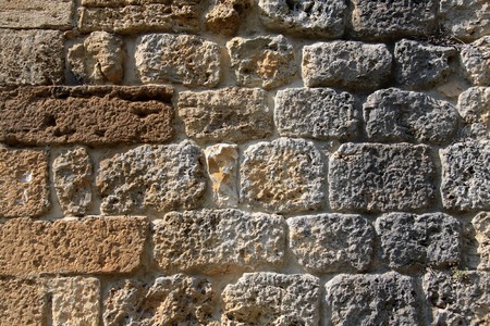 Old stone wall in San Gimignano in Tuscany, Italyの写真素材
