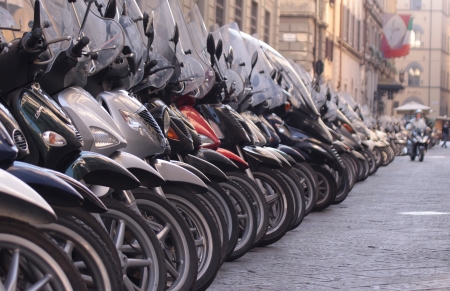 Number of scooters in the old town of Florence, Italyの写真素材