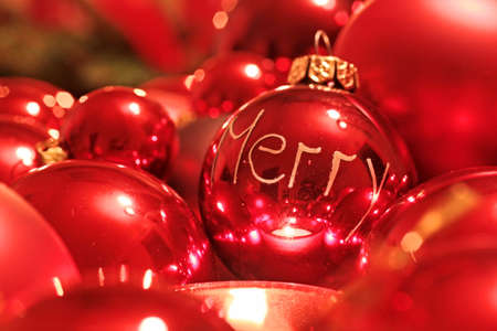 red Christmas balls with words Merry Christmas as decorationの写真素材
