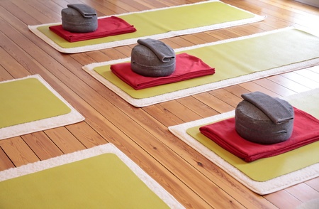 Close-up of yoga mats and yoga cushion in a yoga studioの写真素材