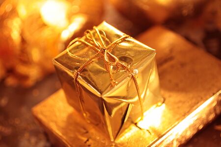 Small sparkling golden packet as Christmas decorationの写真素材