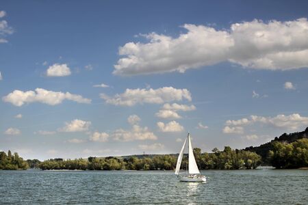 Sailing boat on the Rhine near Ruedesheim in the Rheingau, Hesse, Germanyの写真素材