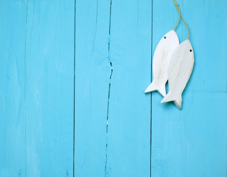 Maritime decorations on a bright blue wooden wallの写真素材