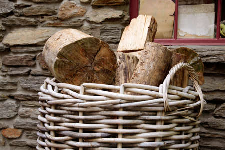 Firewood in basket in front of old house, Cardrona, Otago, South island,  New Zealandの写真素材