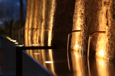 fountain at night, lit atmospherically, Rivoltella on Lake Garda, Region of Brescia, Lombardy, Italyの写真素材
