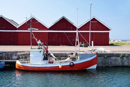 Small, red fishing boatの写真素材