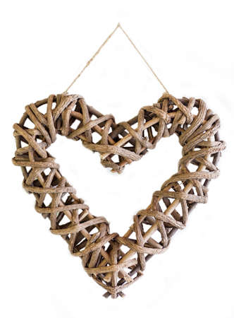 Braided Heart hanging on the white wall, isolatedの写真素材