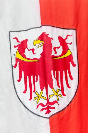 Flag of South Tyrol in Klausen in Chiusa in Valle Isarco,Italyのeditorial素材
