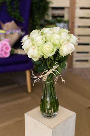 Bouquet of white roses in a glass vaseの写真素材