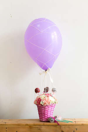 Bouquet of carnation flowers and sweets on a balloonの写真素材