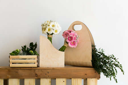 The composition and bouquets of pink and white gerbera and eucalyptus in a wooden boxの写真素材