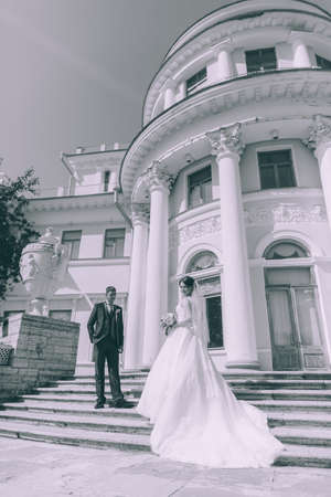 Groom and bride near Wedding palaceの写真素材