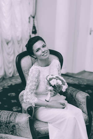 Hipster happy bride and groom in interiorの写真素材