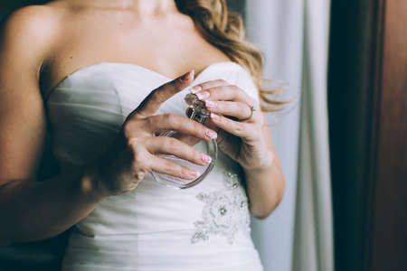 Beauty bride applying perfumeの写真素材
