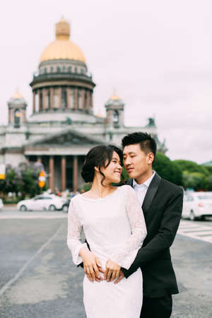 Bride and groom on the background of St. Isaac's Cathedralの写真素材