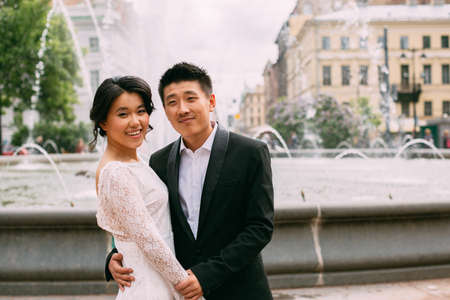 Wedding couple on the background of the fountainの写真素材