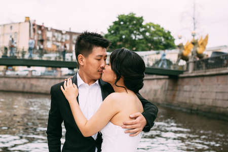 Bride and groom are floating on a boat on the city's rivers and canalsの写真素材