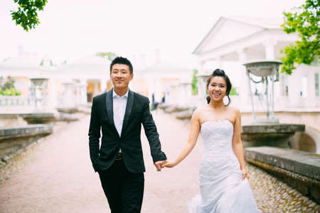 bride and groom posing on the streets of the old cityの写真素材