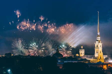 Fireworks over the city of St. Petersburg (Russia) on the feast of "Scarlet Sails", in the rain with fog and smoke.の写真素材