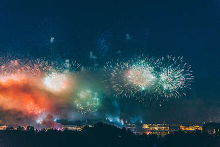 Fireworks over the city of St. Petersburg (Russia) on the feast of "Scarlet Sails", in the rain with fog and smoke.の写真素材
