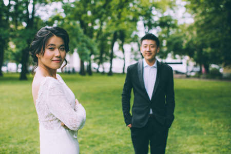 Bride and groom on their wedding day outdoorsの写真素材
