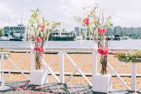 Beautiful wedding arch on the beachの写真素材