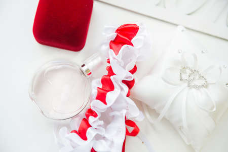 Wedding details. Bridal accessories. perfume, jewelry and rings. Selective focusの写真素材