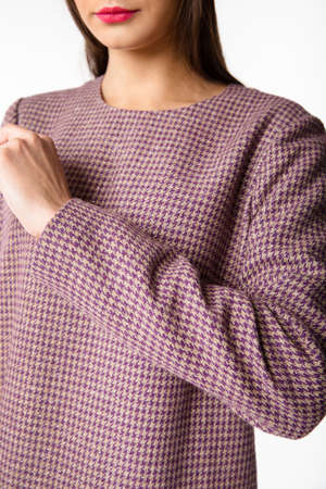 Details of women's clothing. Detail dress on a model on a white background