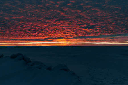 winter landscape - sunset in the snow fieldの写真素材