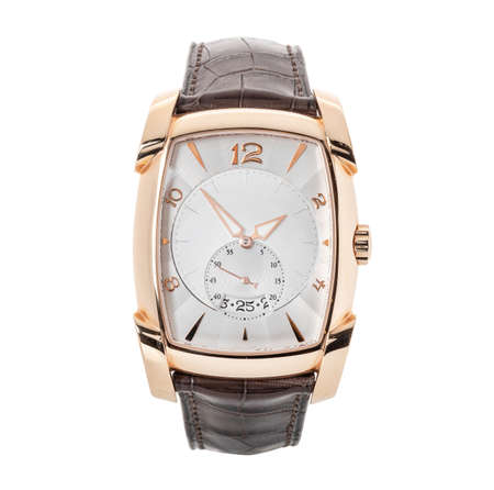 Luxury rose gold watch isolated on white. Classic watch with an annual calendar and a smooth bezel. Front view automatic wristwatch with brown leather strapの写真素材