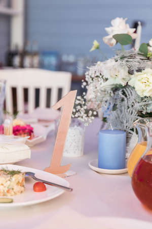 Table set for holiday, event, party or wedding reception in indoor restaurantの写真素材