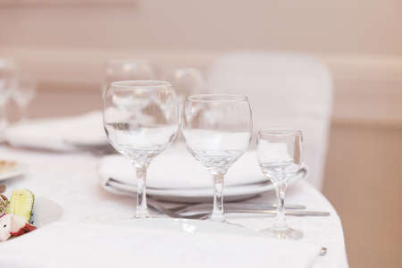 wedding table setting and decorated with flowersの写真素材
