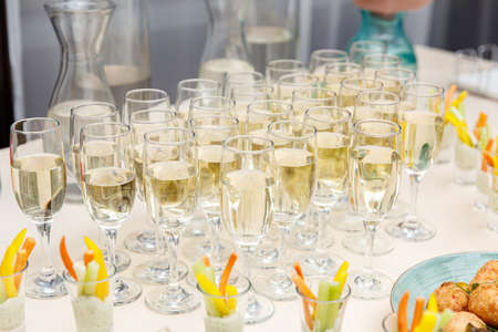 Catering service food and champagne glassesの写真素材