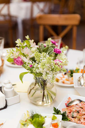 beautifully set tables with glasses and appliances for a wedding or other eventの写真素材