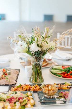 beautifully set tables with glasses and appliances for a wedding or other eventの写真素材
