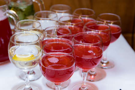 beautifully set tables with glasses and appliances for a wedding or other eventの写真素材