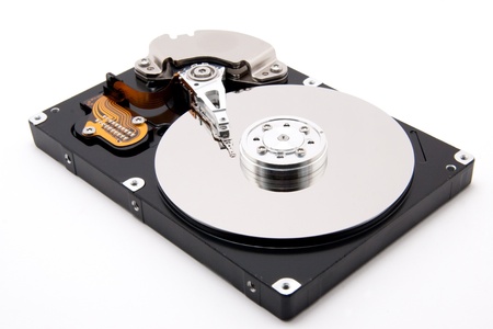 defective open harddrive with write read head on white background
