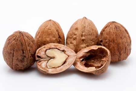 open walnuts on white background