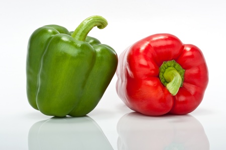 closesup of red and green pepper isolated on white backgroundの写真素材