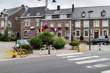 HENRI-CHAPELLE, BELGIUM, 25th JUNE, 2017 - painted bike fixed on a house wallのeditorial素材